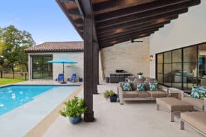 A pool and patio area, featuring outdoor relaxation & dining in Highland Lakes, Texas
