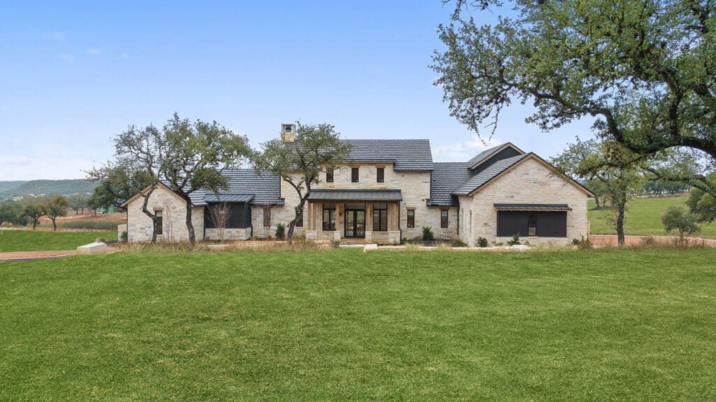 Bluestem stone home with a spacious yard, located between Austin and Dallas, TX