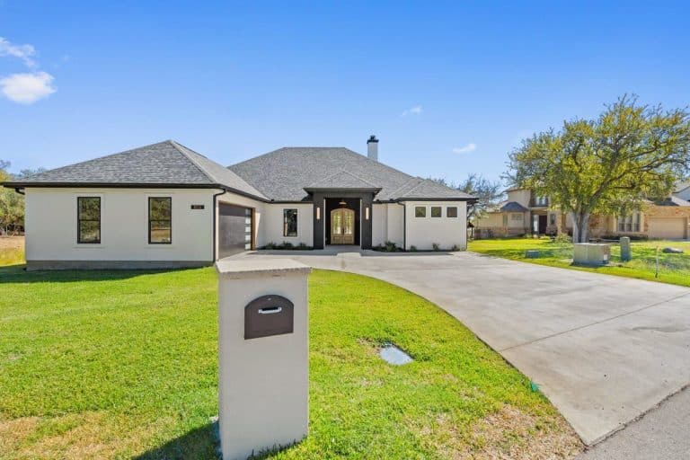 Home with driveway and front lawn featured in Granite Shoals Lodge Gallery near Austin and Dallas TX