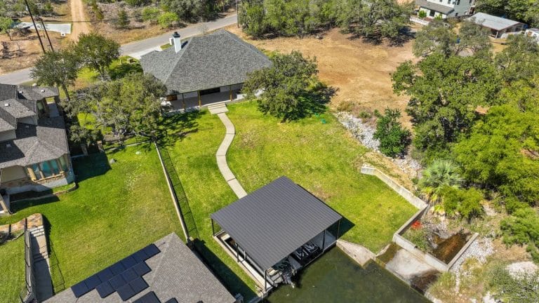 Aerial view of Granite Shoals Lodge Gallery, showcasing a house and yard near Austin and Dallas, TX