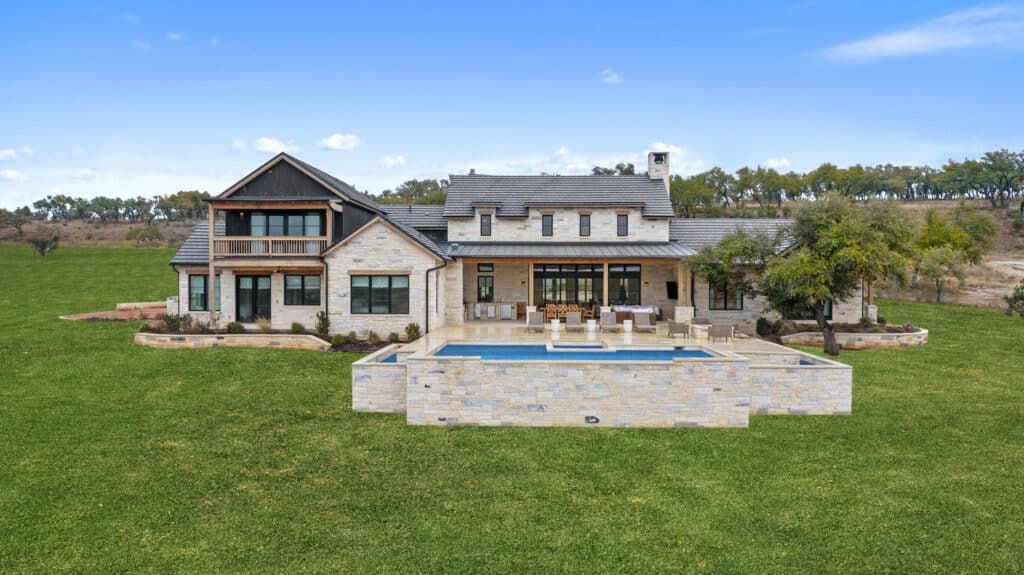 Ridge Drive Ranch features a large home with a pool and spacious yard in Austin, TX, near Dallas