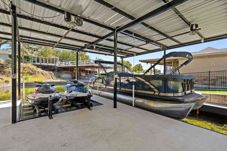 Covered dock with boat and jet skis at Granite Shoals Lodge near Austin and Dallas, TX.