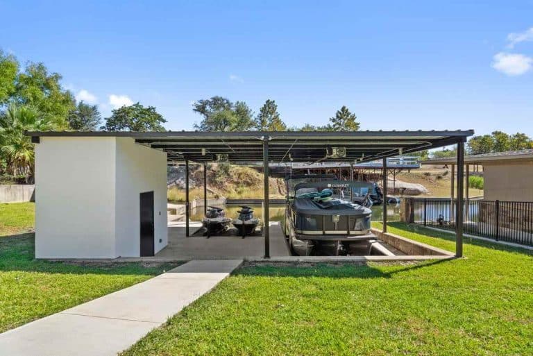 Granite Shoals Lodge waterfront dock with pontoon and jet skis near Austin and Dallas, TX.